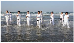 Karate training at the beach in Ehime, Japan. 