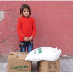 A Syrian girl waits next to relief help at Suruc City, Turkey. (Photo: Caroline Gluck/EU/ECHO)