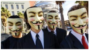 The most famous hacktivist collective is Anonymous, which lacks clear leadership, a cohesive organizational structure and a definitive ideology. Here, members of Anonymous in Los Angeles sport Guy Fawkes masks. (Photo: Vincent Diamante)