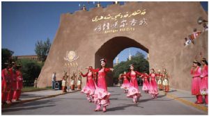 A Kashgar welcoming ceremony featured dancers in ethnic dress in front of the gates of the old city. (Photo: Ülle Baum)