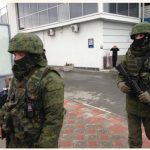 Unidentified gunmen, known at the time as "little green men" were on patrol at Simferopol Airport in Ukraine's Crimea peninsula in February 2014. (Photo: Elizabeth Arrott / VOA)