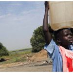 Children across Africa are forced to carry water on their heads over long distances every day, often at the expense of missing school. (Photo: UN)