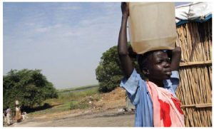 Children across Africa are forced to carry water on their heads over long distances every day, often at the expense of missing school. (Photo: UN)