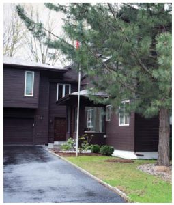 The home's dark exterior is unique in its leafy Rockcliffe neighbourhood. (Photo:  Ashley Fraser)