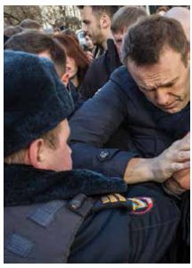 In October, riot police attacked and detained protesters, many of them supporters of lawyer and activist Alexei Navalny, who is shown at the time of his own arrest in March 2017. (Photo: Evgeny Feldman)