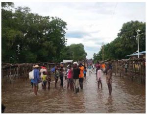 Haitians gather at a flooded market after hurricanes ravaged Ouanaminthe in northeast Haiti in 2017. Climate change is an even more serious concern in Latin America. (Photo: Josiah Cherenfant, VOA Creole Service)