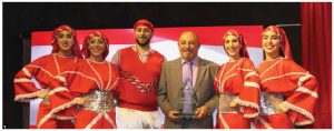 The Al-Arz Lebanese Art Group, a North American Lebanese dance group, participated at Ottawa Welcomes the World festivities during the Lebanese national day reception at Lansdowne Park's Horticulture Building. Dancers are shown with Tony Yazbek, founder and leader of the group. (Photo: Ülle Baum)