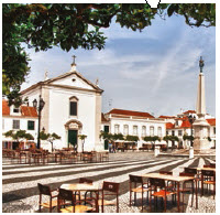 The Algarve region, whose southern tip lies three hours south of Lisbon, also offers dolphin-watchng. The town square is shown here. (Photo: Bert Kaufmann)