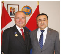 Senator Joseph Day received the Mongolian Presidential Friendship Medal for chairing the Canada-Mongolia Parliamentary Friendship Group. From left: Day and Bayanbat Bayasgalan, counsellor and chargé d’affaires. (Photo: Ülle Baum)  