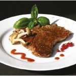 Mushroom-dusted veal chops with Mustard Red Currant Sauce make for a meaty main course. (Photo: Larry Dickenson)