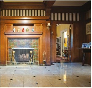 This fireplace, one of six in the residence, greets visitors when they arrive. (Photo: Ashley Fraser)