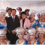 Chinese Ambassador Lu Shaye and his wife, Wang Liwen, (both centre) stand with performers in colourful traditional costumes during the Chinese National day celebrations at the Chinese Embassy. (Photo: Ülle Baum)