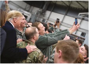 President Donald Trump shook hands and took photos with military personnel during a stopover at Ramstein Air Force Base in Germany, following his unannounced visit to U.S. troops at the Al-Asad Airbase in Iraq, just days after he announced he wanted an eventual withdrawal from Afghanistan. (Photo: OFFICIAL WHITE HOUSE PHOTO BY SHEALAH CRAIGHEAD)