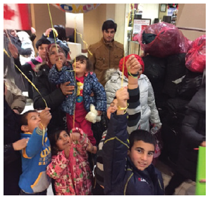 Omidvar and 16 others sponsored this family of 12 from Syria in 2015. This photo was taken when they landed in Canada. (Photo: Compliments of Ratna Omidvar)