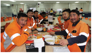 Workers eat at the Oyu Tolgoi copper and gold mine, jointly owned by Turquoise Hill Resources Ltd., Rio Tinto Group and state-owned Edrenes Oyu Tolgoi in Khanbogd, the South Gobi Desert. At the end of the first quarter of 2019, the mine, the largest private employer in Mongolia, had a total workforce of 16,600 of which 92.6 per cent were Mongolians. (Photo: Ülle Baum)