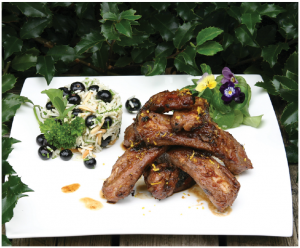 Quick Irresistible Barbecued Ribs make a tasty main course when served with some pretty rice pilaf on the side. (Photo: Larry Dickenson)