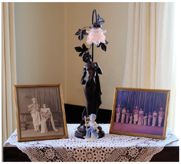 The home is full of family treasures, including these wedding photos of the couple. The chest they are on is a family heirloom called a petagama, used to store clothes during the monarchical era. (Photo: Dyanne Wilson)