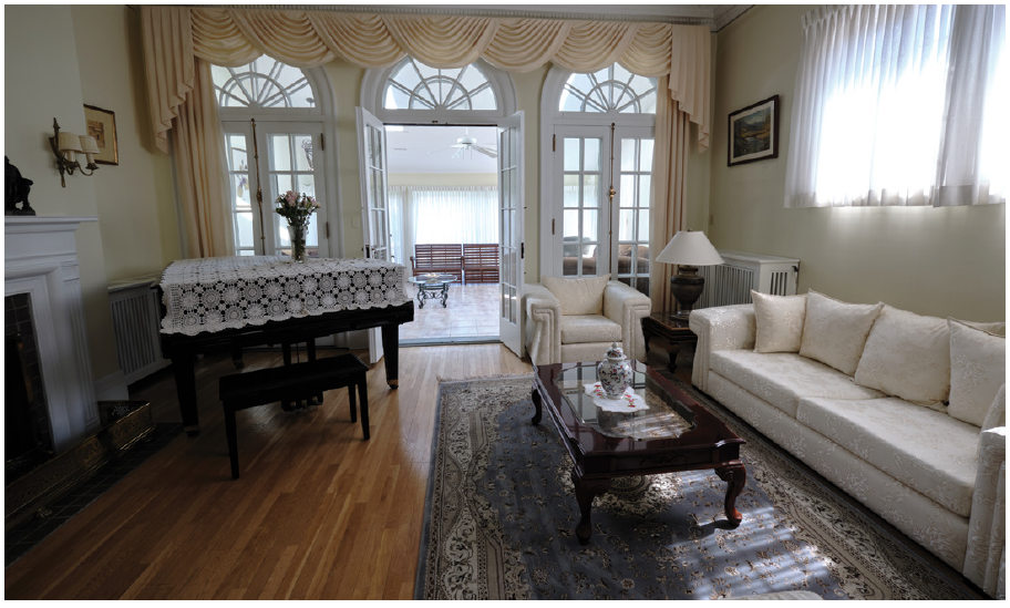 This reception room serves as a secondary space for large crowds and connects to a pretty sunroom on the south side of the home. (Photo: Dyanne Wilson)