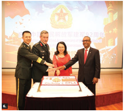 To mark the 92nd anniversary of the founding of the Chinese People’s Liberation Army, Col. Junhui Wu and his wife, Hongyan Yang, hosted a reception at the embassy. From left: Wu, Col. Acton Kilby, Department of National Defence, chargé d'affaires Mingjian Chen and MP Chandra Arya participated in the cake-cutting ceremony. (Photo: Tao Lei)