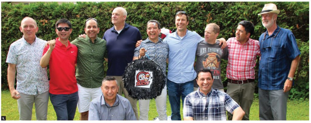 The Ottawa Service Attaché Association’s Lame Ducks hockey team members and coaches attended a  birthday party for Mexican defence attaché Pedro Judas Ornelas Cruz. From left back row: Coach Darcy Byrtus, ChangBae Yoon (Korea), Fernando San Martin (Peru), Ton Linssen (Netherlands), Pedro Judas Ornelas Cruz (Mexico), Tony Stibral (U.S.), Rob Worsham (U.S.), Jorge Castillo (Chile) and Denis Rouleau, coach (Canada). Front row: William Cabrera Castro (Colombia) and Eric Zendejas Hinestrosa (Mexico). Ornelas Cruz is holding a piñata in the shape of a hockey puck and the team logo. (Photo: Ülle Baum) 