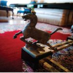 This galloping horse ardorns one of the legs of a coffee table in the main reception room of the residence. (Photo: Ashley Fraser)