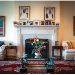 A painting in the large sitting room off the hall, where ochre walls, a fireplace and fringed, cream-coloured sofas blend formality and comfort, shows Kuwait's connection with the water, situated, as it is, at the tip of the Persian Gulf. (Photo: Ashley Fraser)