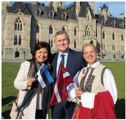  The annual Baltic Unity Day took place on Parliament Hill. Estonian Ambassador Toomas Lukk is flanked by his wife, Piret Lukk, and Inara Eihenbauma, wife of the Latvian ambassador Karlis Eihenbaums. (Photo: Ülle Baum) 