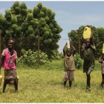 Access to water for drinking, cooking, washing and other daily needs has become increasingly unequal. These children, in South Sudan, must transport it for their families. (Photo: UN photo)