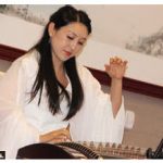 Tong Zhang, wife of Chinese Ambassador Peiwu Cong, hosted a "cultural salon on winter treats," featuring a concert with national instruments as well as martial arts demonstrations and a cooking show. This musician performed on a Chinese zither, which dates back 2,500 years. (Photo: Ülle Baum)