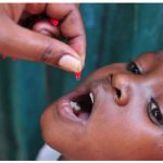 A child receives a dose of Vitamin A supplementation in Kenya. Giving malnourished children two capsules per year, up to the age of five, reduces their mortality by 24 per cent. (Photo: nutrition international)