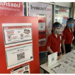 This supermarket in Bangkok requires visitors to scan a QR code before entering. Staff are doubly protected with face masks and shields. (Photo: chainwit)