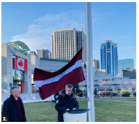 Members of the diplomatic community and Latvian diaspora attended the Latvian flag-raising ceremony. Jim Watson, right, delivers remarks while the ambassador looks on. (Photo: Ülle Baum) 