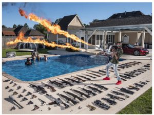 Spectacular moments in photojournalism, including a former U.S. Marine at home with his gun collection, make up the World Press Photo of the Year exhibition at the Canadian War Museum. (Photo: Canadian War Museum/World Press Photo)