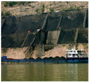 Although China touts the fact that it is making major investments in renewable energy, it is also boosting its reliance on coal by continuing to construct hundreds of coal-fired electricity plants. Shown here is a coal shipment headed to China. (Photo:  Rob loftis)