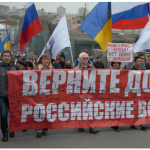 Shown here are Russians demanding their government ”bring Russian troops home” from Ukraine in 2013, before Russia invaded Crimea. (Photo: Dhārmikatva)