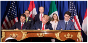 Then-Mexican president Enrique Peña Nieto, then-U.S. president Donald Trump and Prime Minister Justin Trudeau sign the new CUSMA agreement during the 2018 G20 summit. (Photo: White House)