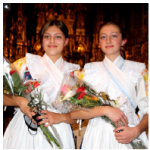 From left, Terezia Koziakova and Sabina Koziakova, daughters of Slovakian Ambassador Vit Koziak, performed three Slovakian Christmas songs at the EU concert. They are wearing traditional handmade costumes decorated with embroidery done using a “curved needle” technique. (Photo: Ülle Baum)
