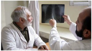 Doctors in a TB hospital in Afghanistan analyze some test results. TB has become a more pressing problem as COVID concerns have overtaken efforts to curb it. (Photo: un photo )