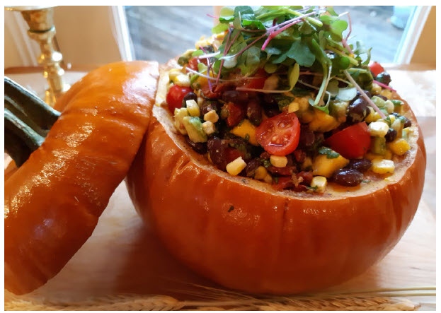 Black Bean Salad served in seasonally appropriate fashion in a whole roasted pumpkin adds excitement to a harvest or Halloween table. (Photo: Margaret Dickenson)