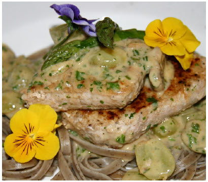 Cumin Pork in Grape and Mushroom Sauce is an interesting main course when served with cooked asparagus spears and long young carrots. (Photo: Larry Dickenson)