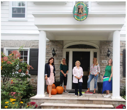 Shown standing in front of the Belgian ambassador's residence are HOMSA Europe Group executive team members Piret Lukk, Jenni Ahlin, Victoria Carol Eriksson, Kathleen Billen and Dorota Skuseviciene. They prepared 75 welcome bags with European treats and delivered them to HOMSA members across the city. (Photo: Ülle Baum)