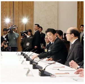 Japanese officials and experts, shown here at their first pandemic meeting in February 2020, have helped keep COVID-19 at bay, thanks to a cluster-based approach to tracking infections. (Photo:  Japanese Cabinet Secretariat)