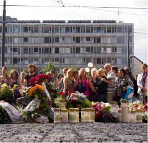 Mourners and community members gathered at the Oslo Cathedral the day after Anders Behring Breivik, a right-wing extremist, detonated a car bomb in Olso's city centre, killing eight people before posing as a police officer at a summer camp and gunning down 69 more young Norwegians.  (Photo: Johannes Grødem)