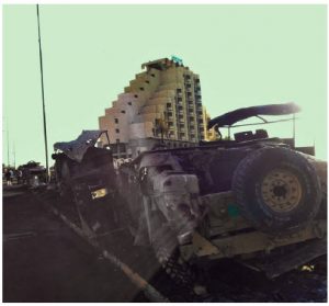 This Humvee was overturned in a clash between Iraqi and IS forces. IS’s seizure of Mosul led to an exodus of Christians. Those who didn't leave were forced to convert on pain of death. (Photo: Omar Siddeeq Yousif)