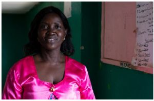Every day after school, Ms. Kemokai works with a group of five over-age girls at Dominic Hena Primary School in Liberia to help them succeed academically and develop important life skills. (Photo: CODE/ Jefferson Krua, 2020)