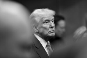  Black and white portrait of Donald Trump, expressing the controversial nature of his foreign policy decisions.