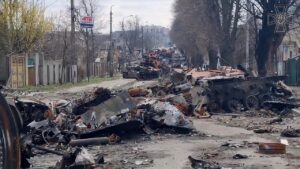  Destroyed Russian tanks and vehicles lining the main street in Bucha, Ukraine, following a brutal battle.